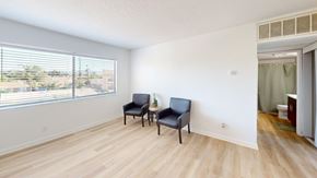 Van Nuys apartment for rent - A room with a window and two chairs.