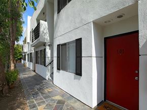 Studio City apartment for rent - entrance to a unit with a red door and a walkway