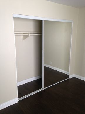 Studio City apartment for rent - A white closet with a mirror door is open.