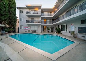 Los Angeles apartment for rent - a pool is shown in the middle of an apartment building