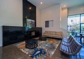 Inglewood apartment for rent - A living room with a fireplace and a couch.