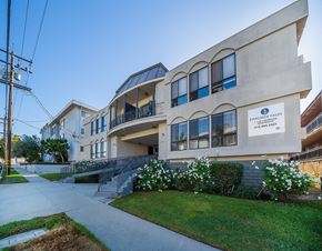 Inglewood apartment for rent - A building with a sign that reads "Evergreen Fields" is shown.