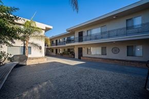 Inglewood apartment for rent - A sunny day at a residential complex with a clear blue sky.