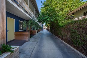 Inglewood apartment for rent - A narrow street between two rows of houses.