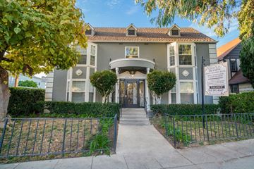 Los Angeles apartment for rent - A building with a sign that says "CAPITAL OLYMPICS" is shown.