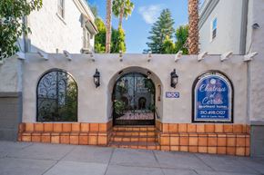 Hollywood apartment for rent - A white building with a blue sign that says Chateau El Cerrito.