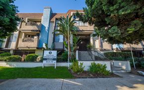 Van Nuys apartment for rent - an apartment building with a sign in front of it