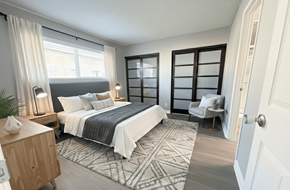 La Mesa apartment for rent - A bedroom with a large bed and a chair.