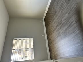 Van Nuys apartment for rent - A room with a window covered by blinds.