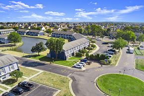 Toms River triplex for rent - an aerial view of a building next to a body of water