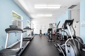 Chatsworth apartment for rent - A spacious gym with treadmills, elliptical machines, and other exercise equipment.