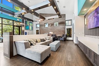 A large living room with couches and a tv