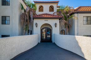 Long Beach apartment for rent - the front door of a building with palm trees