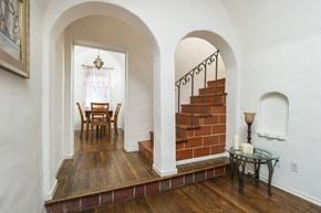 Los Angeles apartment for rent - Villa Valentino 14 Dining Room and a brown staircase with arched ceilings