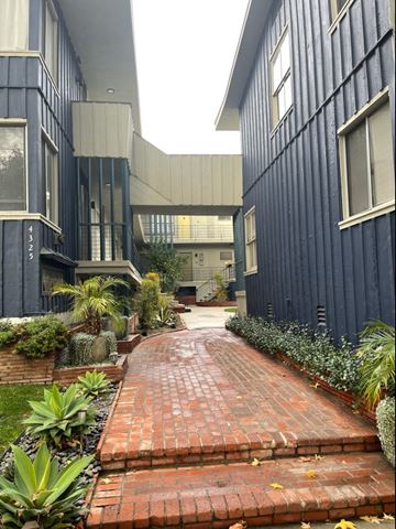 Los Angeles apartment for rent - a courtyard with a brick path between two buildings