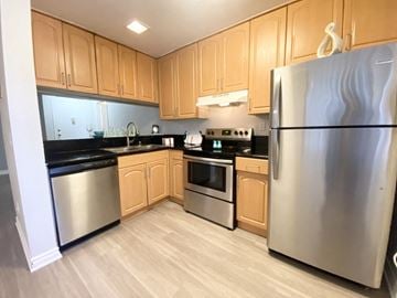 La Mesa apartment for rent - a kitchen with stainless steel appliances and wooden cabinets