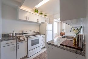 Washington apartment for rent - Updated kitchen with white appliances and granite countertops at 4000 Massachusetts Avenue Apartments, Washington, DC