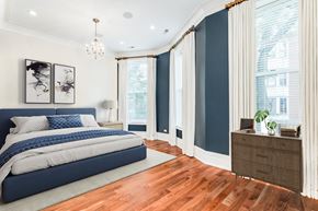 Chicago apartment for rent - a bedroom with blue and white walls and a bed