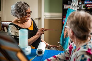 Women doing a painting