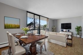 Ottawa apartment for rent - A modern dining room with a wooden table and chairs.