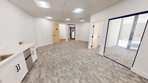 Atlanta apartment for rent - A spacious office room with a carpeted floor and white walls.