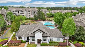 Stonecrest apartment for rent - The leasing office and resident clubhouse  with a pool in the background.