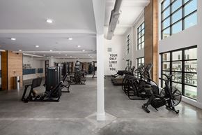 Douglasville apartment for rent - a gym that fits all your needs for any HIIT workout with ellipticals, free weights,treadmills, yoga mats, leg press, smith machine, and motivation