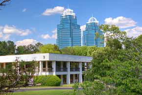 Atlanta apartment for rent - A white building with a green lawn in front of it.