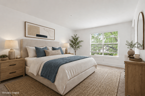 Lithia Springs apartment for rent - A bedroom with a large bed, a nightstand, and a mirror.