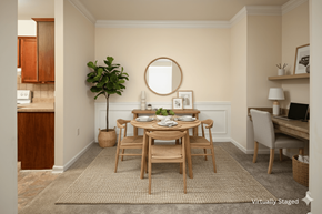 Stonecrest apartment for rent - A dining room with a round mirror and a dining table with chairs.