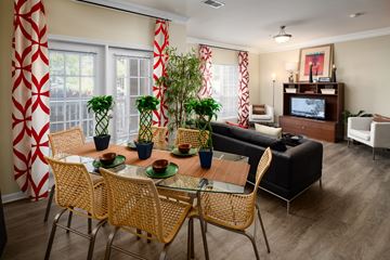 Stonecrest apartment for rent - a living room and dining room with a table and chairs