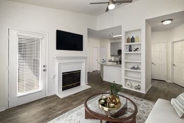 Atlanta apartment for rent - a living room with a fireplace and a table