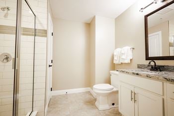 Ceramic tile floors in the bathrooms