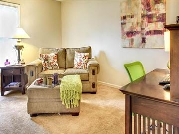 Euclid apartment for rent - a living room with a couch and a chair and a desk