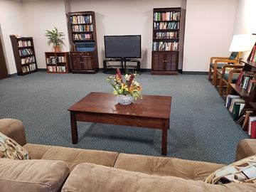 Twinsburg apartment for rent - A living room with a couch, a coffee table, and a television.