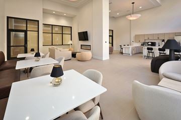 Cleveland apartment for rent - A modern living room with a white dining table and chairs.