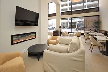 Modern community lounge with tvs & bar area