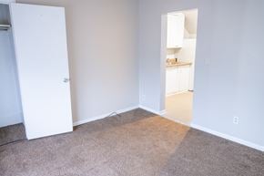 Rapids townhouse for rent - A room with a white door and a carpeted floor.