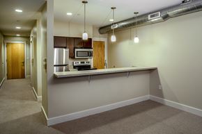 Grand Rapids townhouse for rent - A kitchen area with a microwave, oven, and sink.