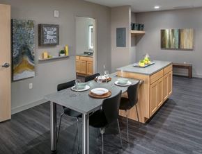 Grand Rapids apartment for rent - A modern kitchen with a dining table set for two.