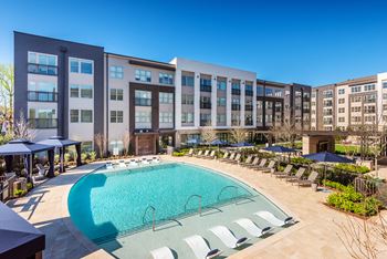 Resort-style pool courtyard with pool-side cabanas
