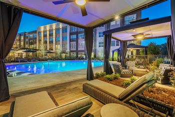 Resort-style pool courtyard with pool-side cabanas