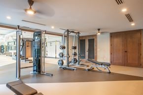 Raleigh apartment for rent - a gym with weights and exercise equipment in a home