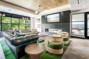 Raleigh apartment for rent - a living room with couches and chairs and a fireplace