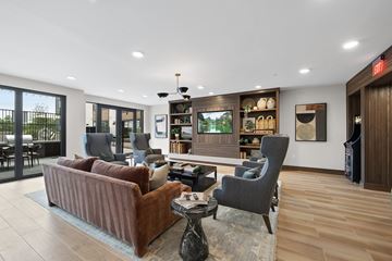 Raleigh apartment for rent - a living room with couches and chairs and a television