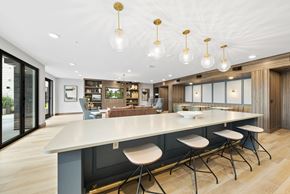 Raleigh apartment for rent - a large kitchen with a large island and chairs