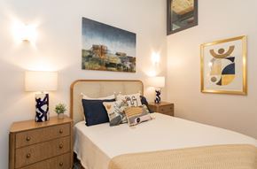 Greensboro apartment for rent - a bedroom with a bed and a painting on the wall