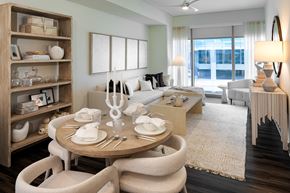 Raleigh apartment for rent - Living room with oversized windows and neutral furnishings