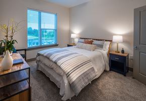 Pittsboro apartment for rent - a bedroom with a bed and two night stands