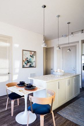Raleigh apartment for rent - A dining area with a white table and chairs.